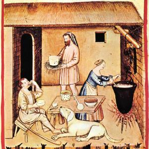 18. El menjar i la beguda són la tercera de les 'coses no naturals'. Elaboració de formatges en un manuscrit del 'Tacuinum sanitatis' (Roma, Biblioteca Casanatense, ms. 4182, s. XIV).